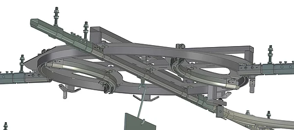 Technische 3D-Darstellung eines Handhängebahnsystems mit mehreren Schienen, Kurven und montierten Laufrollen für den innerbetrieblichen Transport.